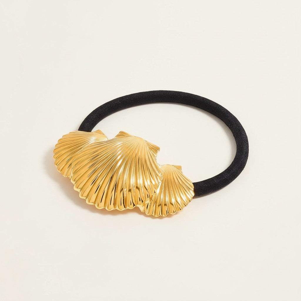 Seraphina Treasures Ishtar gold seashell ribbed hair tie. Black elastic band with decorative gold seashell charm.