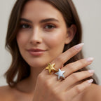 Seraphina Treasures Selora ring in gold and silver, featuring a star design engraved with BLESSING. Modern geometric style.