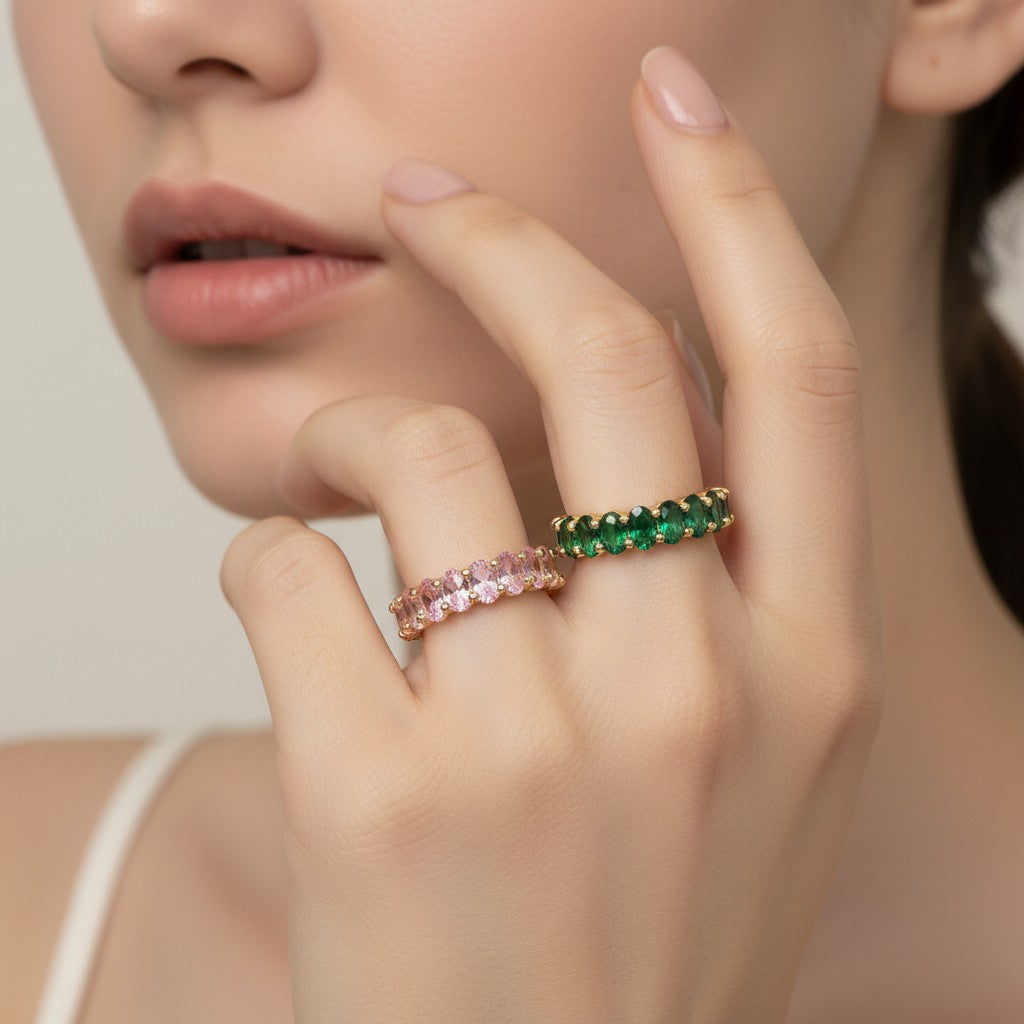 Seraphina Treasures Seraphiel adjustable ring with clear, pink, and green cubic zirconia stones on a gold-tone band.