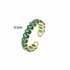 Seraphina Treasures Seraphiel adjustable ring with green cubic zirconia stones and gold-tone copper band.