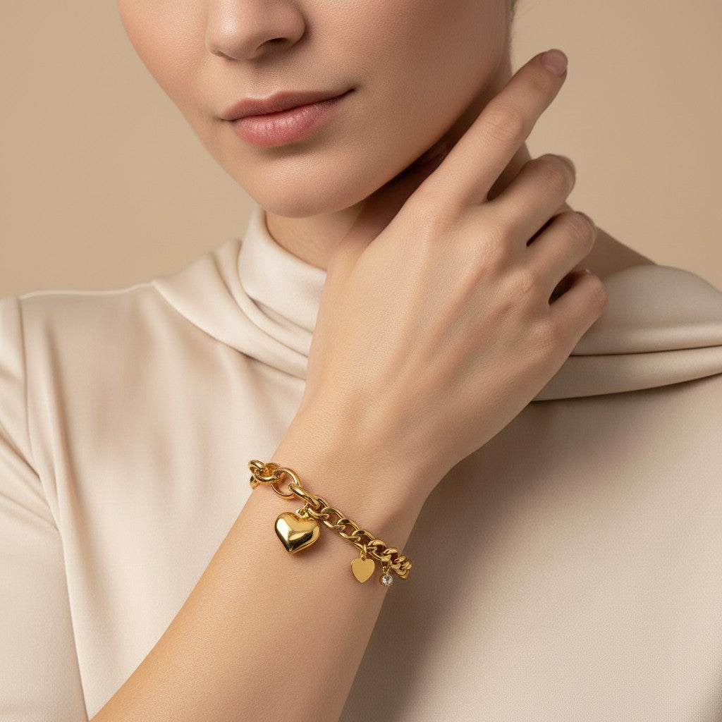 Seraphina Treasures Seren gold-tone bracelet with curb chain, puffy heart charm, and small zircon heart charm.