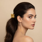 Seraphina Treasures Seshat gold square hair tie with ribbed texture and black elastic band.