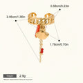 Seraphina Treasures gold-tone ring with shell and coral charms, pearl accent, and red bead chain. Adjustable cuff style.