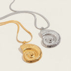 Seraphina Treasures gold and silver shell pendant necklaces with herringbone chains. Beach-inspired statement jewelry.