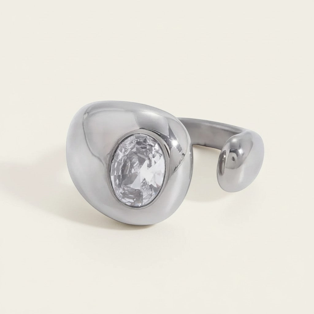 Seraphina Treasures silver open ring with oval crystal accent. Modern, elegant design.