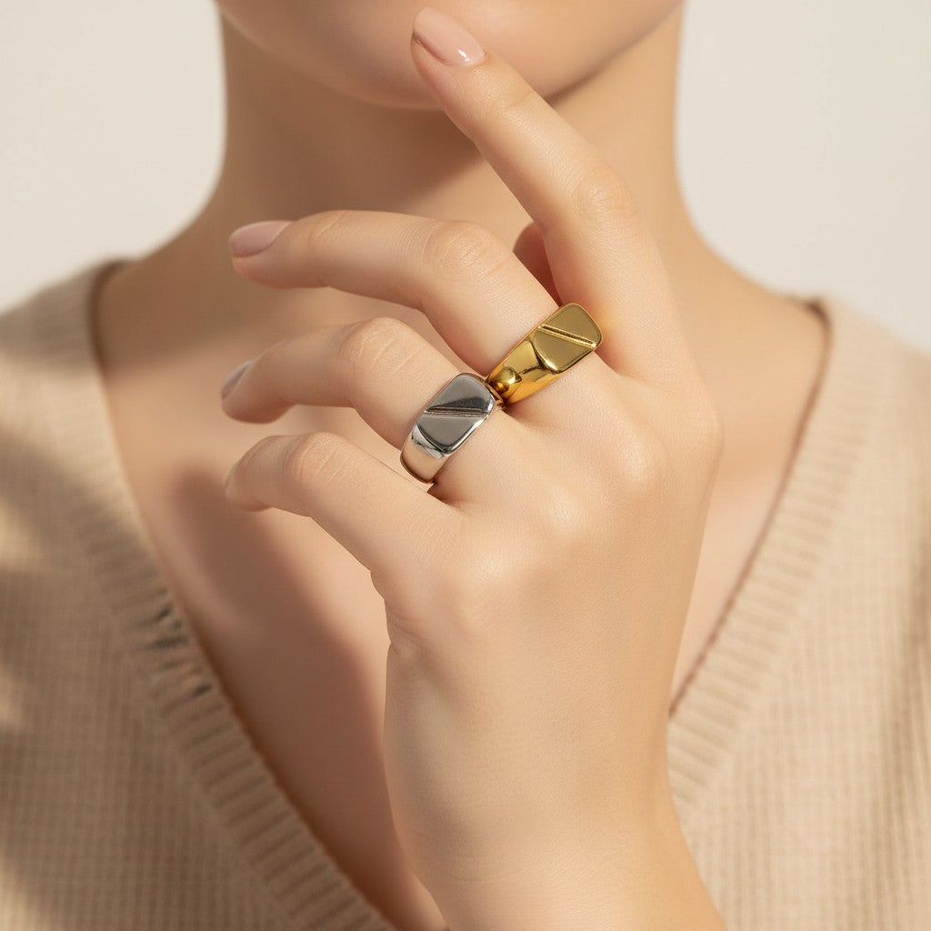 Seraphina Treasures Thalora ring, a sleek silver band with a smooth, geometric design. Waterproof and hypoallergenic.