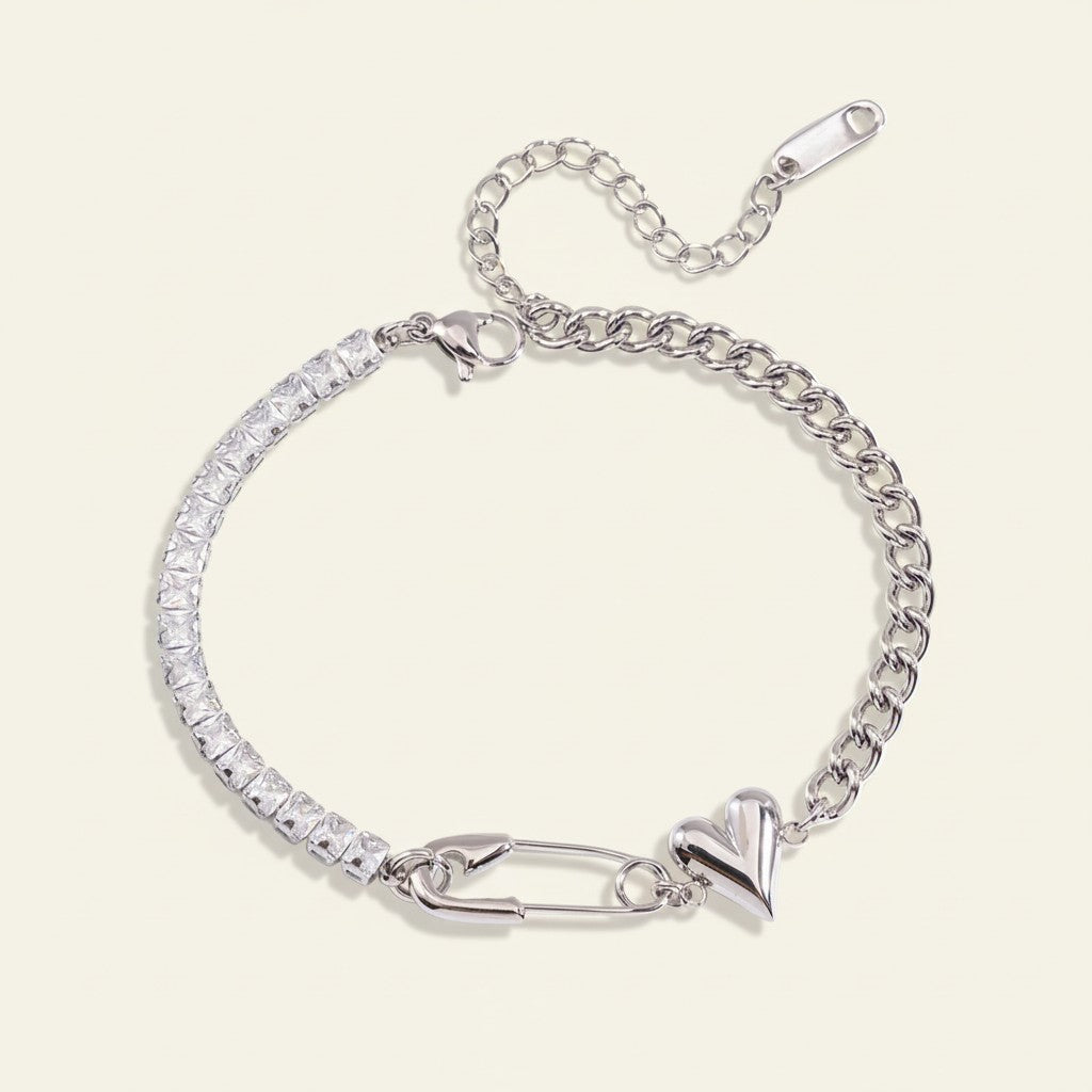 Seraphina Treasures silver bracelet with cubic zirconia, safety pin, and heart charm. Adjustable chain.