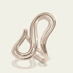 Seraphina Treasures silver sculptural statement ring with a bold, curved design. Modern minimalist jewelry.