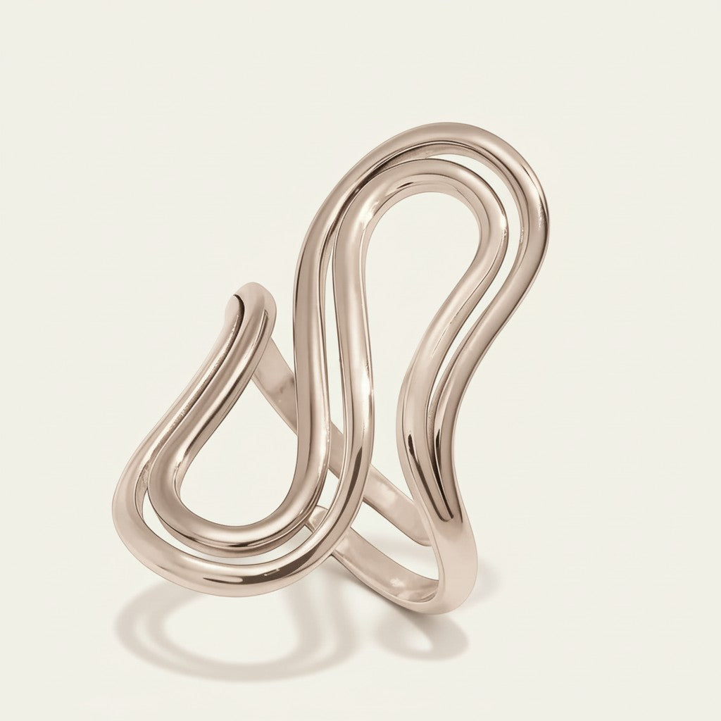 Seraphina Treasures silver sculptural statement ring with a bold, curved design. Modern minimalist jewelry.