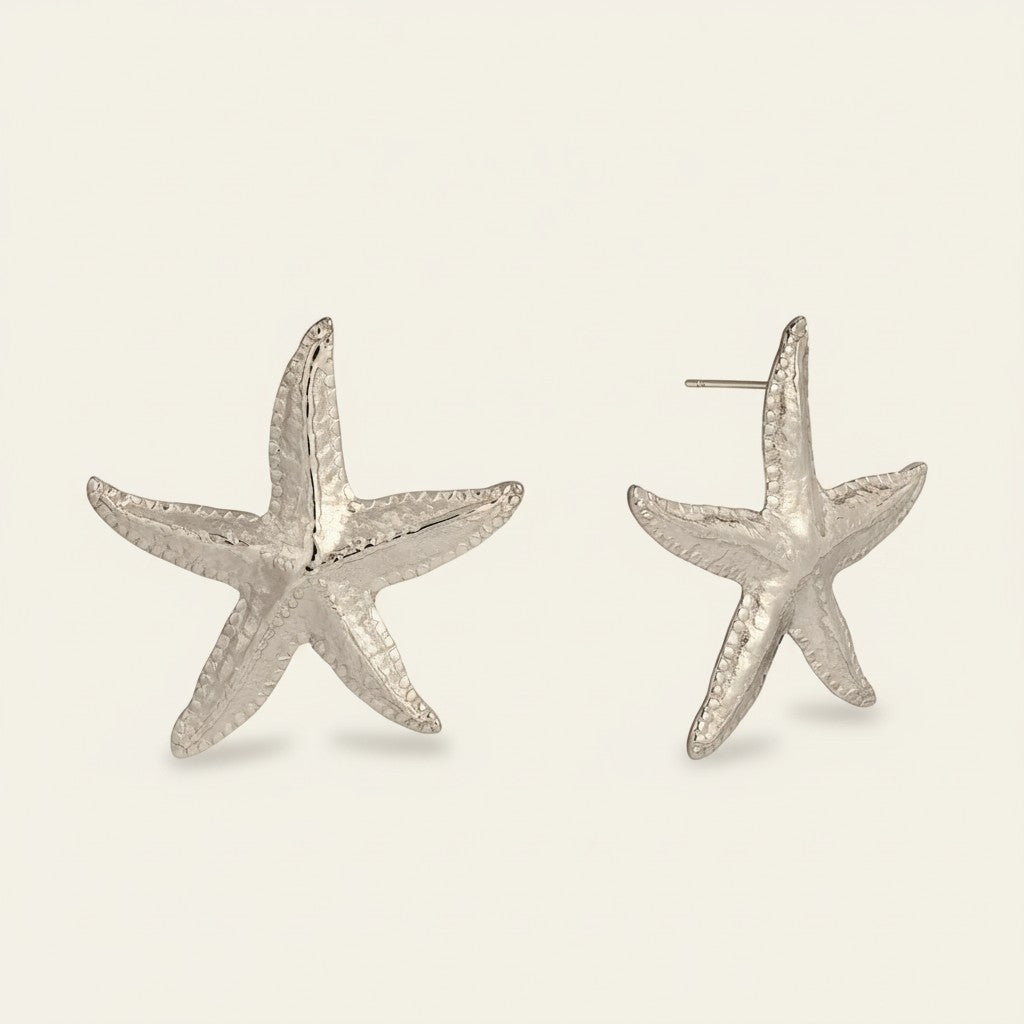 Seraphina Treasures silver starfish stud earrings with textured detail.
