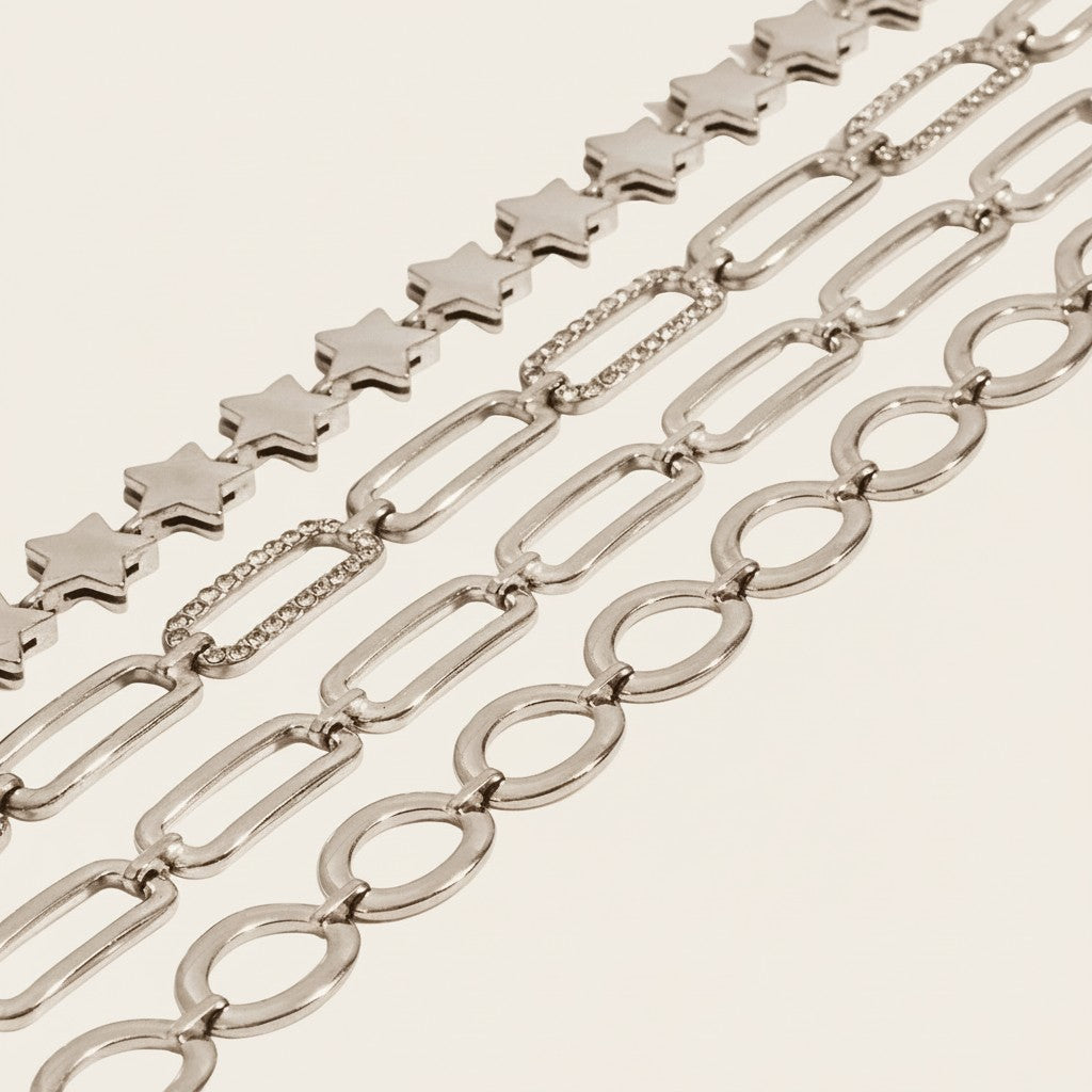 Seraphina Treasures silver-tone bracelets: star chain, oval link chain, and rhinestone-accented chain.