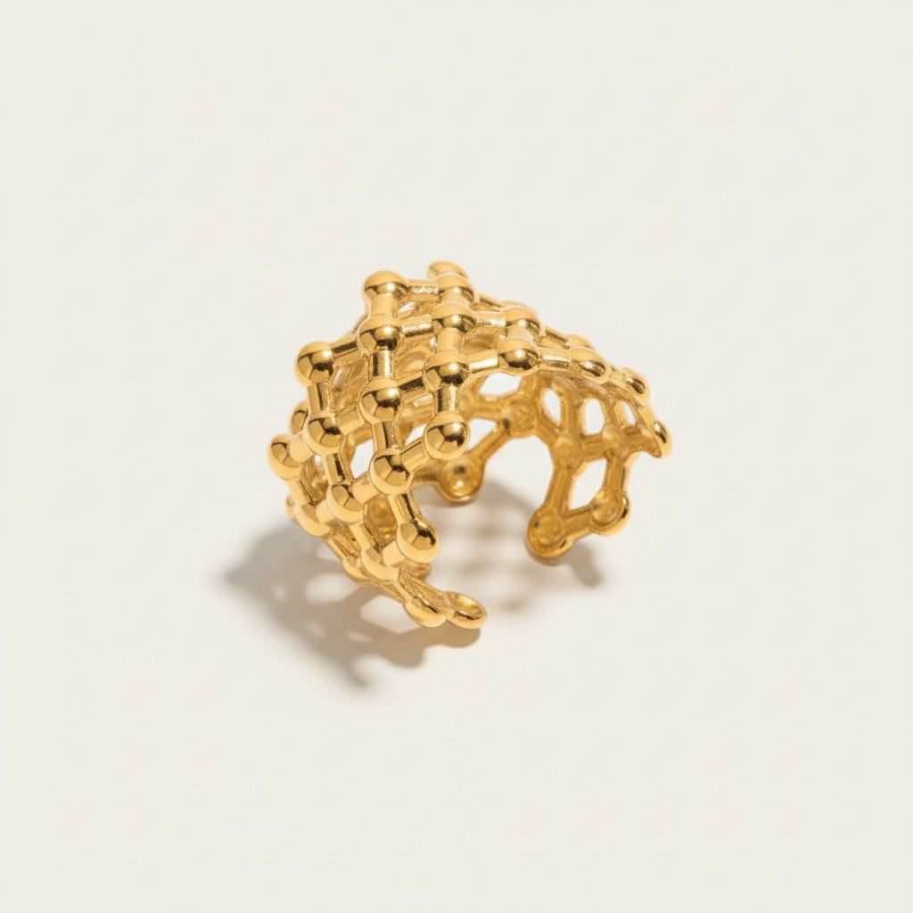 Seraphina Treasures Solanythe gold geometric open band ring with a molecular structure design.