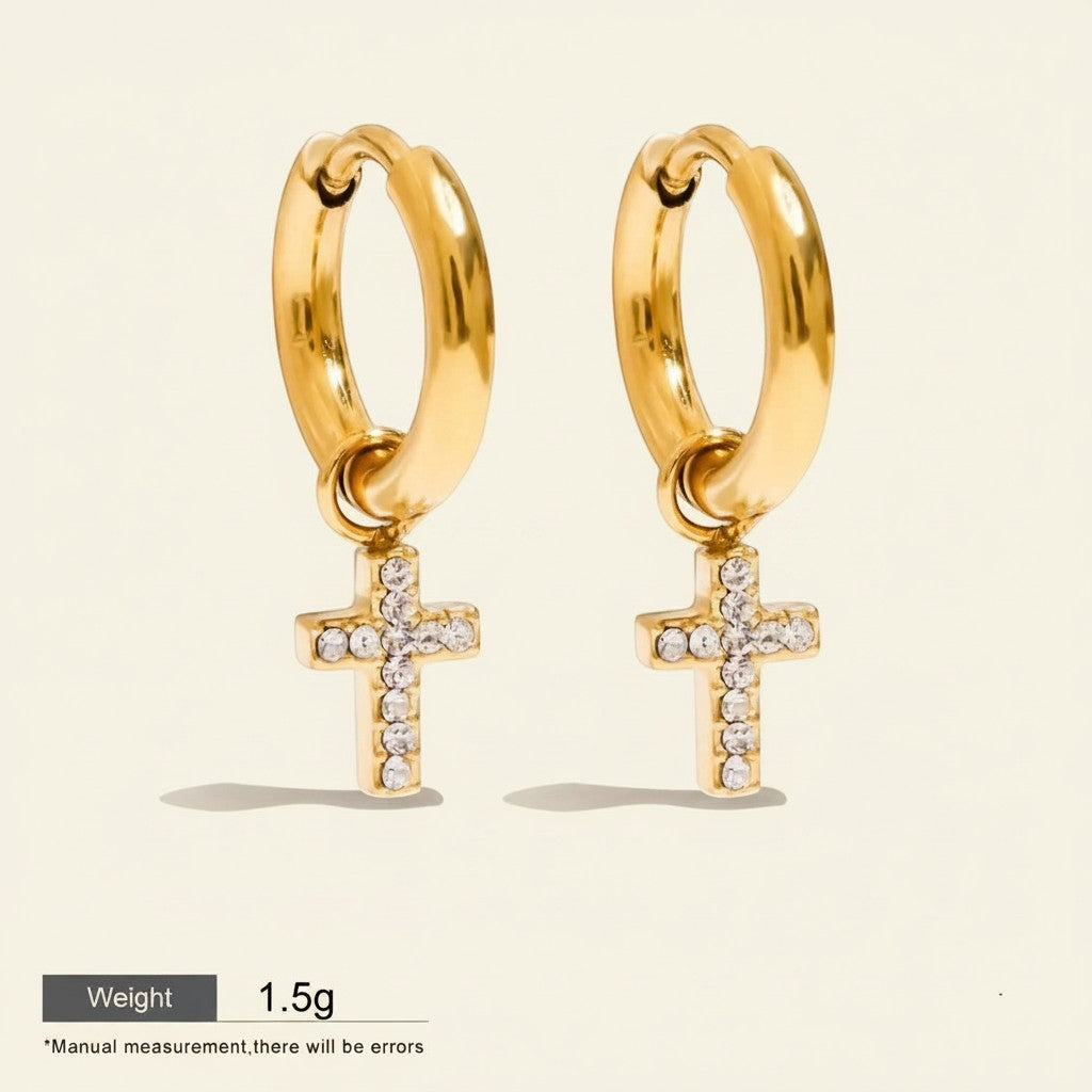 Seraphina Treasures Solara gold hoop earrings with cubic zirconia cross charms. Waterproof and hypoallergenic.