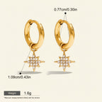 Seraphina Treasures Solara gold hoop earrings with starburst charms encrusted with cubic zirconia. Waterproof & hypoallergenic.