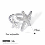 Seraphina Treasures silver open ring with two textured starfish, one large and one small, adjustable size.