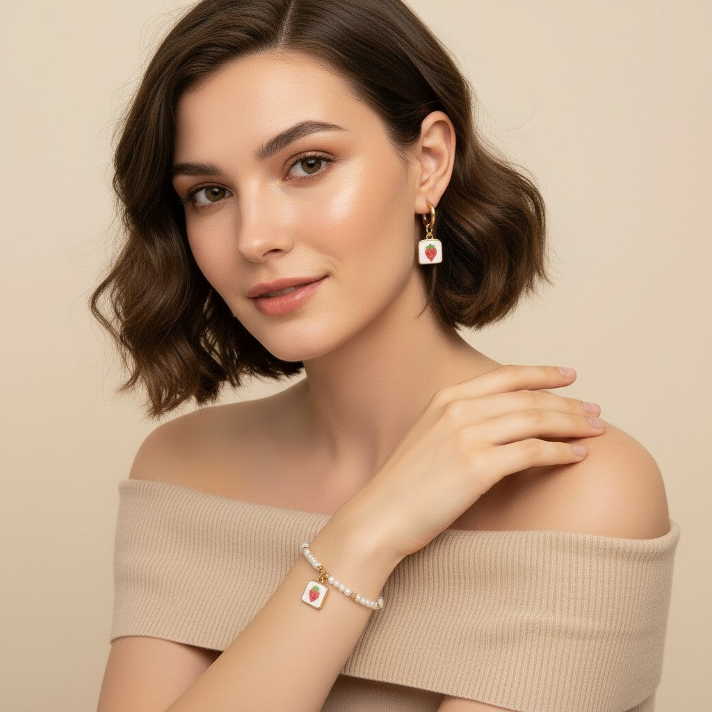 Seraphina Treasures Clytia bracelet and earring set with pearl beads and white square strawberry pendants.