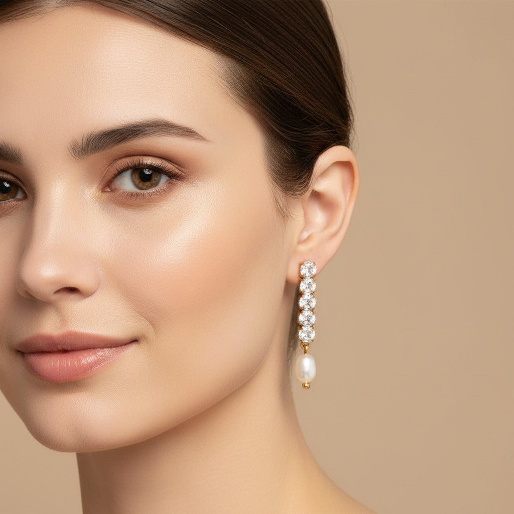 Seraphina Treasures Thalire gold drop earrings with clear cubic zirconia and freshwater pearls.