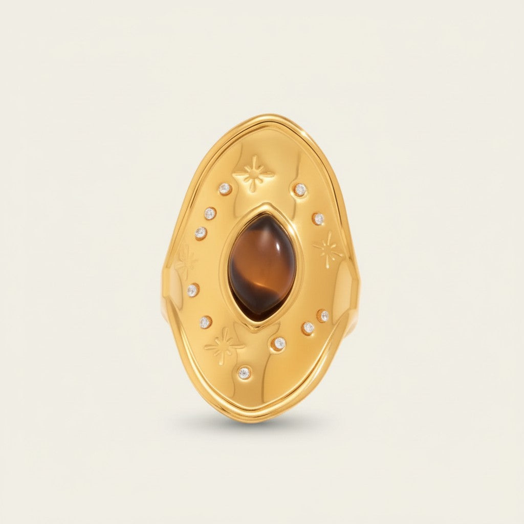 Seraphina Treasures Thalmyra adjustable gold ring with oval tiger eye stone and small clear crystals, star details.