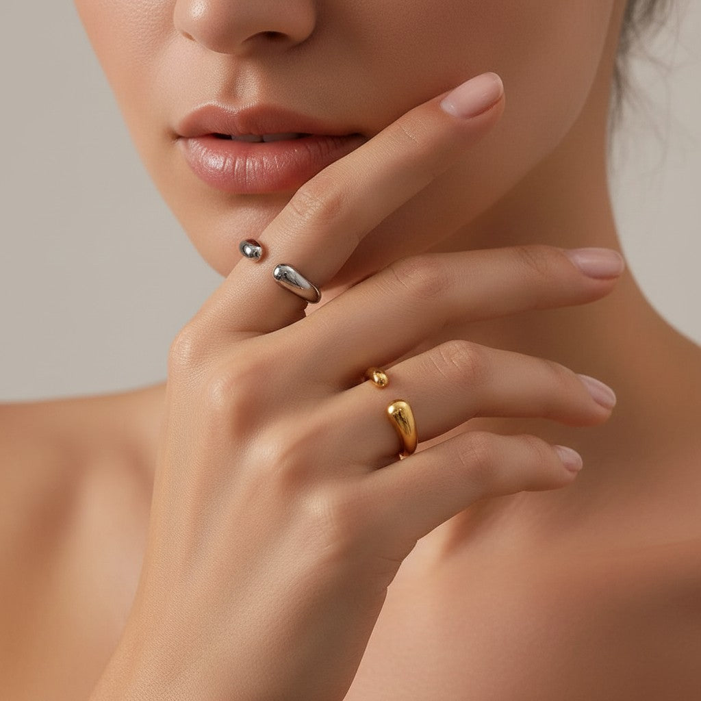 Seraphina Treasures Themis open ring in silver and gold, featuring a modern, minimalist design with teardrop accents.