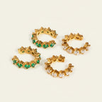 Seraphina Treasures Theonara ear clips with green or white zircon stones. Gold-tone metal, non-piercing design.