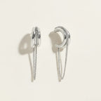 Seraphina Treasures Thryxis silver metal earrings with layered chains and curved design. Modern, elegant drop earrings.
