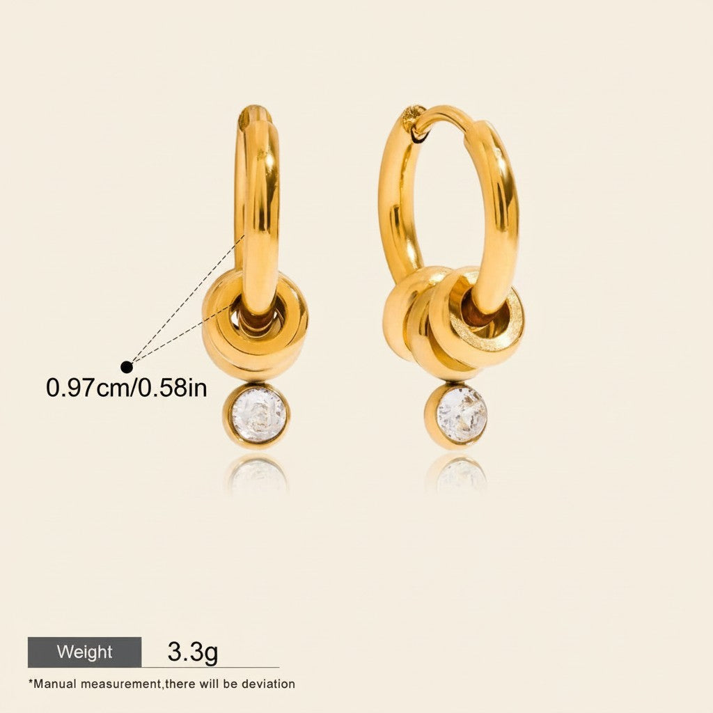 Seraphina Treasures Topazia gold hoop earrings with dangling white zirconia stones. Waterproof and hypoallergenic.