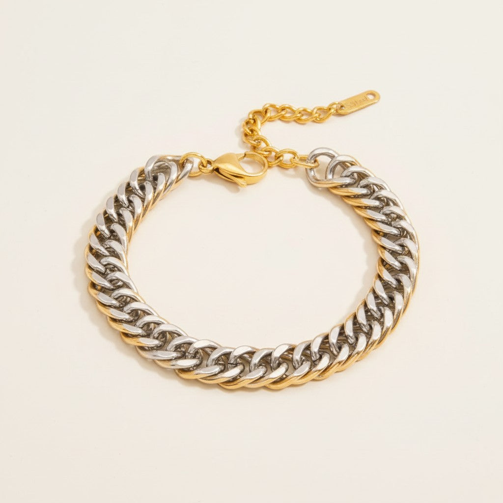 Seraphina Treasures Zephyros two-tone stainless steel curb chain bracelet with gold accents and lobster clasp.