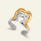 Seraphina Treasures Vaelora ring with intertwined gold and silver heart shapes, symbolizing love and resilience.