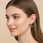 Seraphina Treasures Valencia earrings: silver safety pin style and hoop with pink teardrop gem.