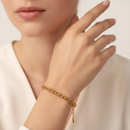 Seraphina Treasures Valoria gold-tone braided chain bracelet on a wrist.