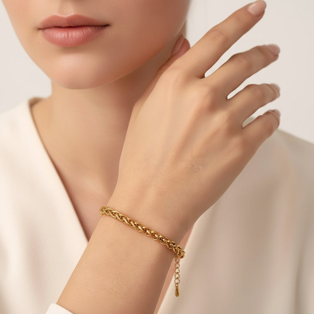 Seraphina Treasures Valoria gold-tone braided chain bracelet on a wrist.