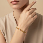 Seraphina Treasures Valoria gold-tone stainless steel braided chain bracelet with lobster clasp.