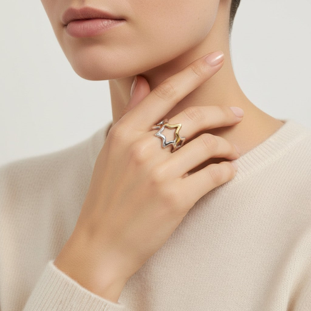 Seraphina Treasures Vespera ring with intertwined silver and gold stars, open cuff design.