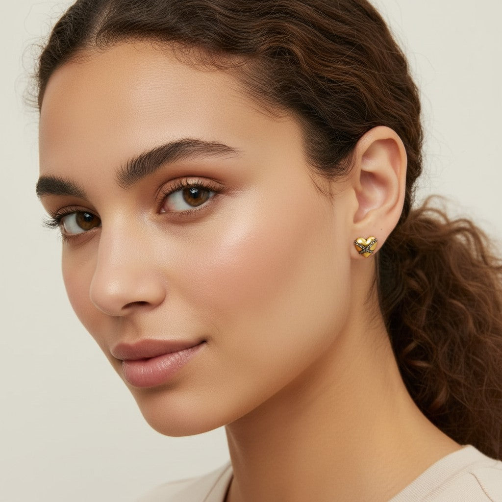 Seraphina Treasures Vespria gold heart earrings with silver chain detail. Designed for everyday elegance.