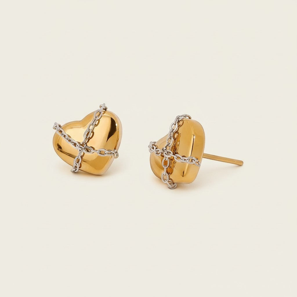 Seraphina Treasures Vespria gold heart earrings with silver chain detail. Elegant stud earrings.