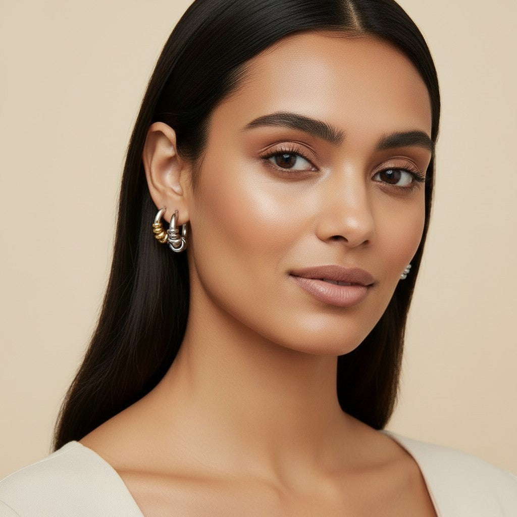Seraphina Treasures Veyora earrings: intertwined silver and gold tone loops, lightweight hoop style.