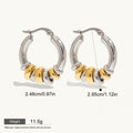 Seraphina Treasures Veyora two-tone hoop earrings with gold and silver intertwined loops. Hypoallergenic.