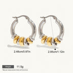 Seraphina Treasures Veyora two-tone hoop earrings with gold and silver intertwined loops. Hypoallergenic.