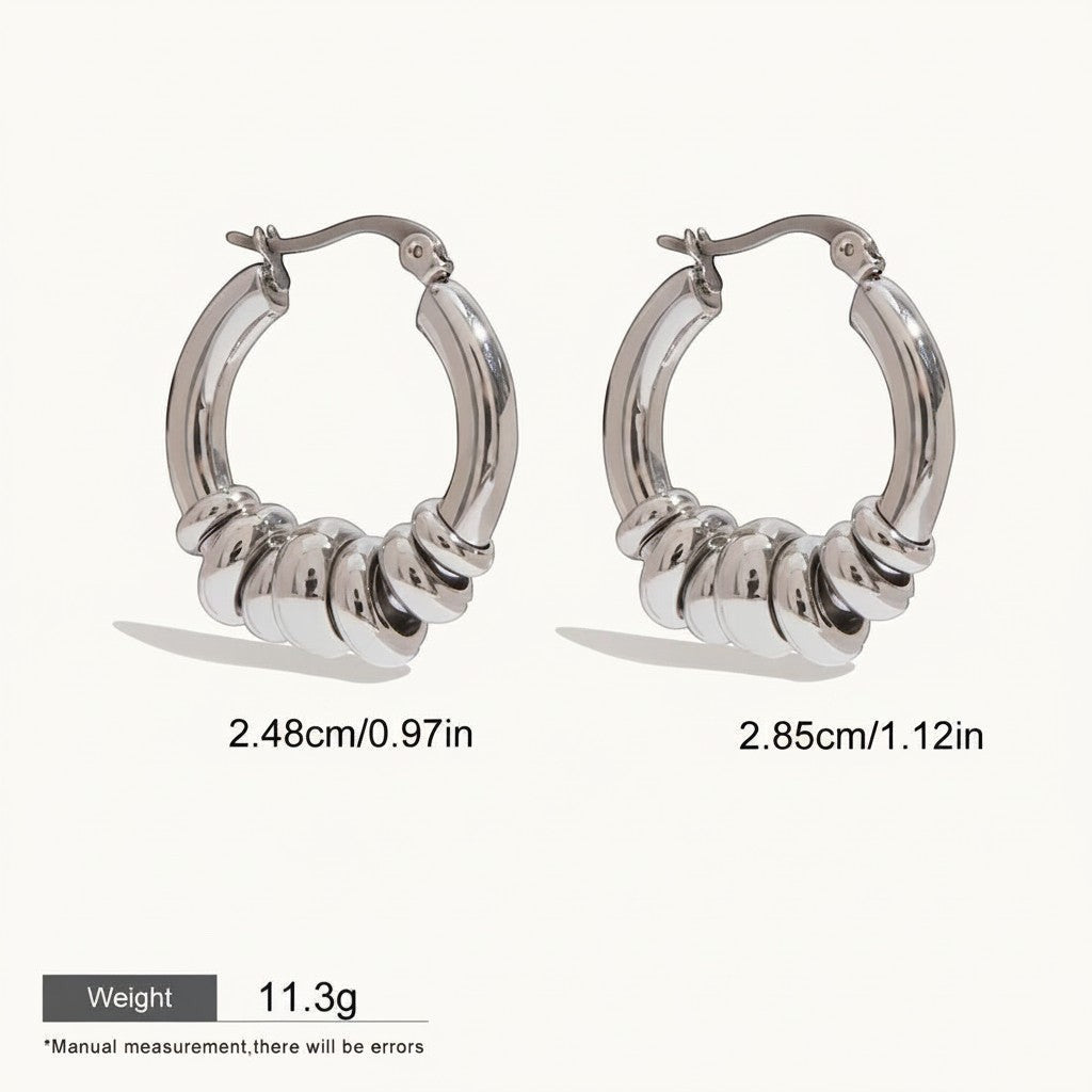 Seraphina Treasures Veyora silver tone hoop earrings with intertwined loops, 2.48cm and 2.85cm.