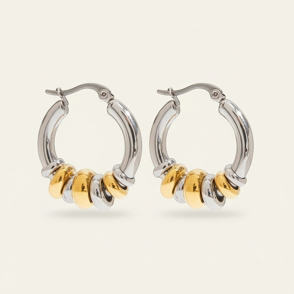 Seraphina Treasures Veyora two-tone hoop earrings with gold and silver looped charms. Lightweight metal.