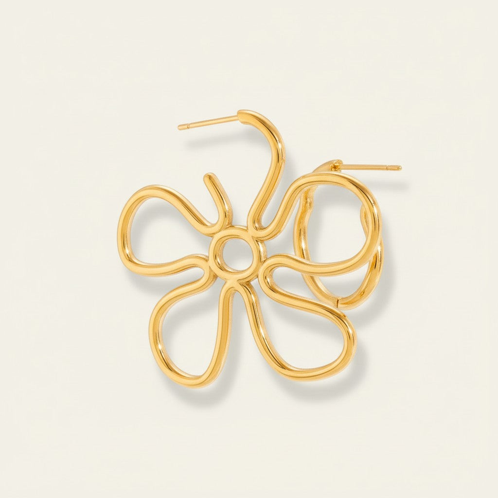 Seraphina Treasures Vyranthea gold flower hoop earrings with delicate, intricate design.