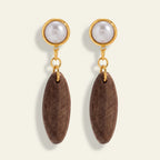 Seraphina Treasures Thessaliah earrings with brown wood oval drops and white imitation pearls.
