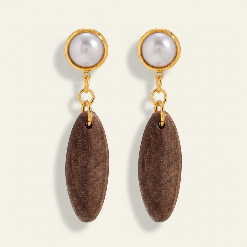Seraphina Treasures Thessaliah earrings with brown wood oval drops and white imitation pearls.