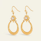 Seraphina Treasures Xantheon gold celestial earrings with sunburst top and hammered moon drop.