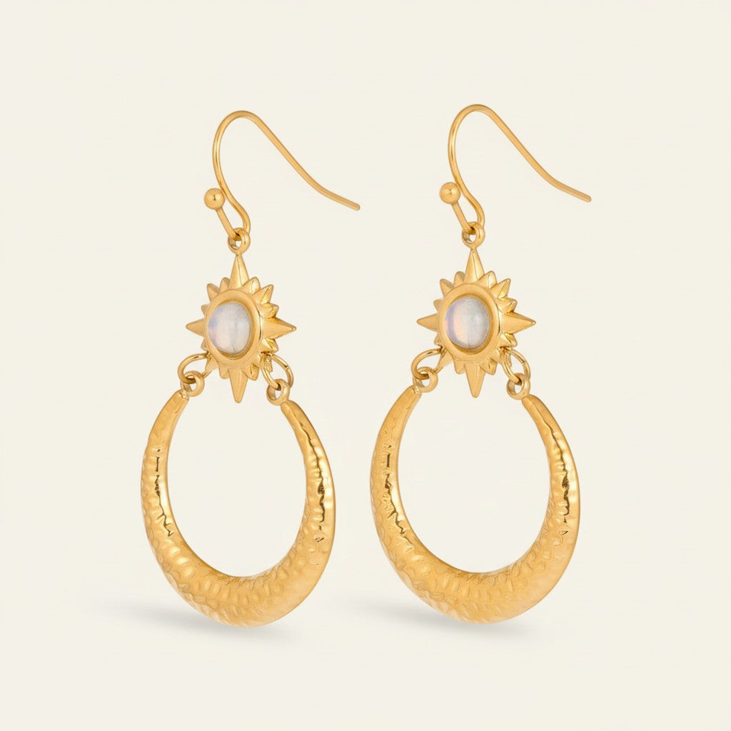 Seraphina Treasures Xantheon gold celestial earrings with sunburst top and hammered moon drop.