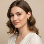 Seraphina Treasures Zahara gold flower stud earrings with subtle color accents.