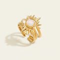 Seraphina Treasures Zaleon gold sun opal ring. Three delicate bands stack to form a sun design with a central opal.