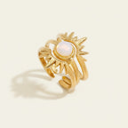 Seraphina Treasures Zaleon gold sun opal ring. Three delicate bands stack to form a sun design with a central opal.