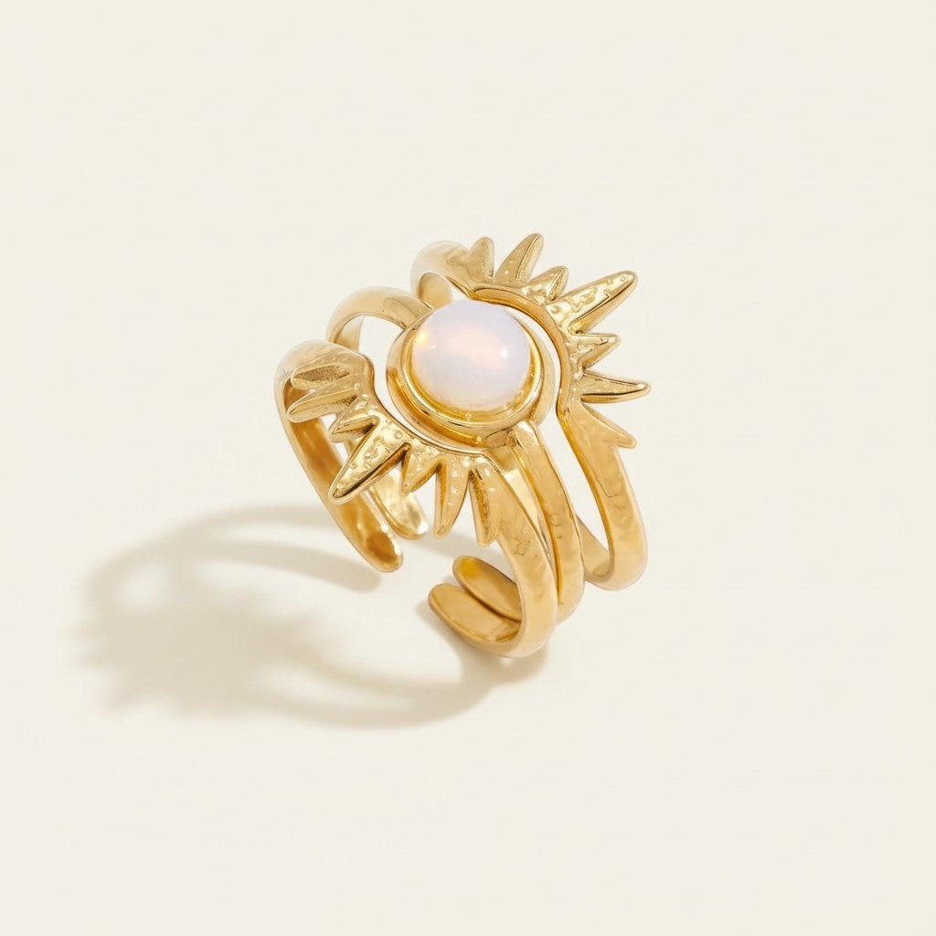 Seraphina Treasures Zaleon gold sun opal ring. Three delicate bands stack to form a sun design with a central opal.