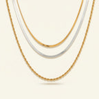 Seraphina Treasures Zephoria layered necklace with gold rope and herringbone chains and a silver herringbone chain.